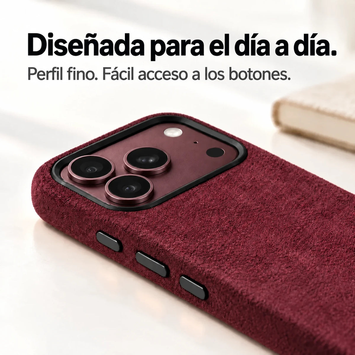 Low-angle view of a Burgundy fabric phone case with a matching Burgundy phone camera surface and black rim. #color_Burgundy