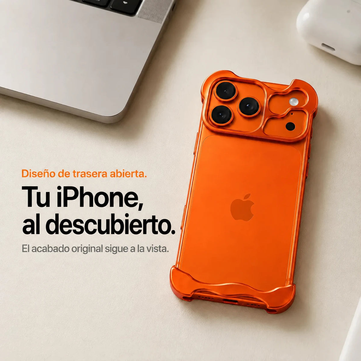 Orange open-back phone case resting beside a laptop #color_Cosmic Orange
