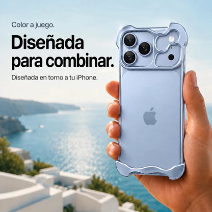 Glacier sculpted metal phone case held in a hand above a coastal background #color_Glacier
