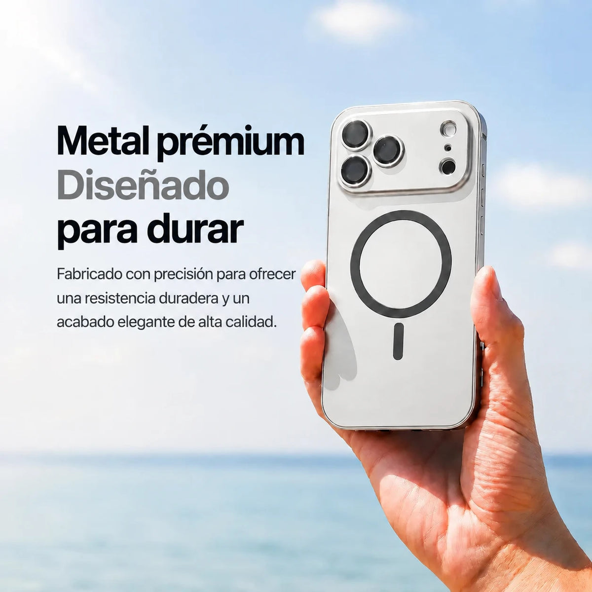 Silver metal magnetic phone case held upright beside the sea with a material feature caption #color_Titanium Silver