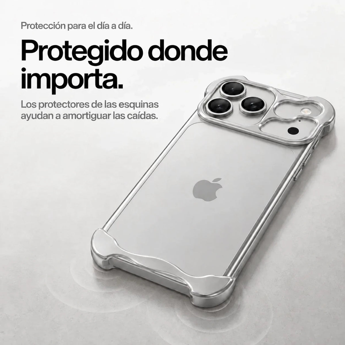 Silver sculpted metal phone case on a desk showing its protective corner bumpers #color_Titanium Silver