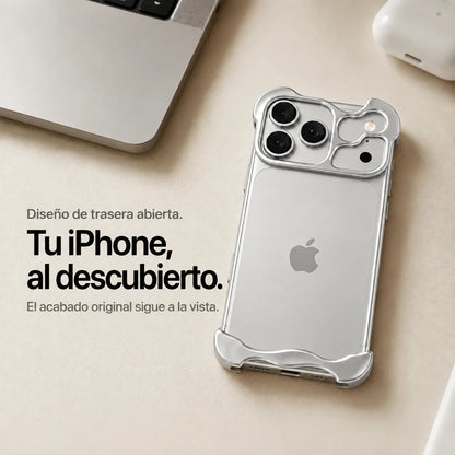 Silver sculpted metal phone case on a desk showing the open back #color_Titanium Silver